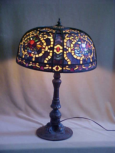 Lg. Tiffany Style Leaded Glass Lamp: Quality Reproduction Lg. Tiffany Style Leaded Glass Lamp w/ Decorative Bronze Base Measures 16 1/2" x 24"high