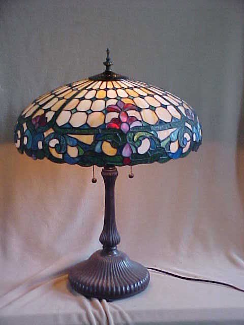 Lg. Tiffany Style Leaded Glass Lamp: Lg. Quality Reproduction Tiffany Style Leaded Glass Lamp w/ Decorative Bronze Base Measures 18 1/2" x 23"high