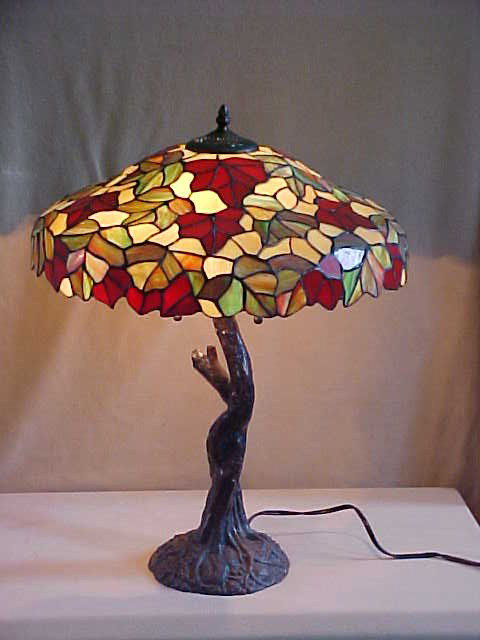 Lg. Tiffany Style Leaded Glass Lamp: Quality Reproduction Lg. Tiffany Style Leaded Glass Lamp w/ Bronze Tree Design Base Measures 18 1/2" x 22 1/2"high