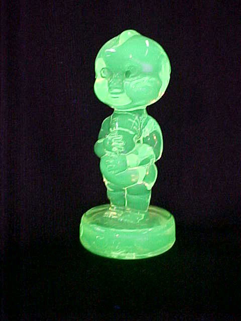 Boyd Glass Vaseline glass Kewpie doll.: Boyd Glass Vaseline glass Kewpie doll. Measures 4-1/2"tall x 2"thick.