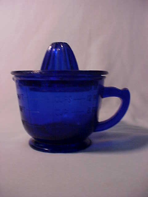 U.S. Glass Co. Cobalt blue juicer w/cup base.: U.S. Glass Co. Cobalt blue juicer w/cup base. Measures 6"tall x 6"wide.