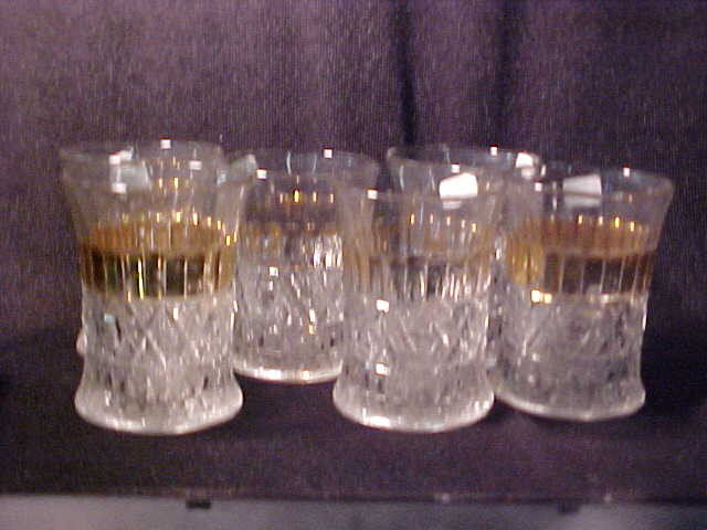 U.S. Glass 1800's era Diamond Star water set w/go: U.S. Glass 1800's era Diamond Star water set w/gold band. Pitcher measures 8-3/4"tall x 6-1/2"wide & (6) cups 4"tall x 3-1/4"wide.