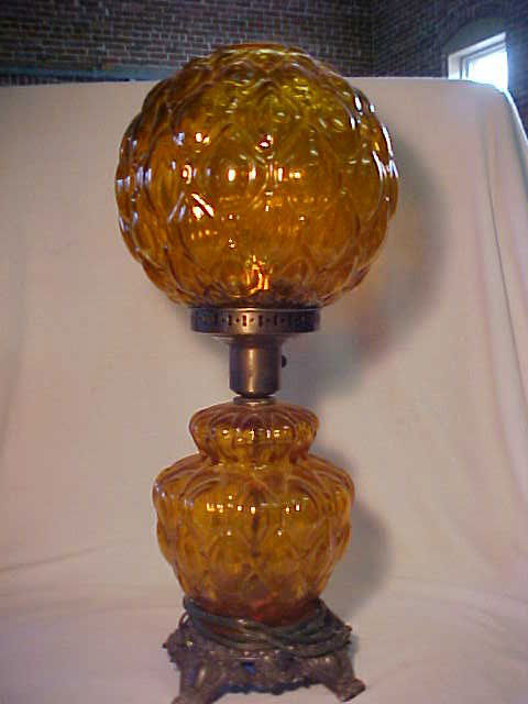 1960's electric Gone With The Wind style lamp.: 1960's electric Gone With The Wind style lamp. Quilted pattern Amber base & shade. Measures 22"tall x 9". No chimmey.