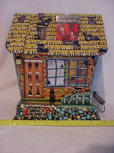 Tin litho haunted house w/movement.: Tin litho haunted house w/movement. Minor scratches from age & usage. One button cap missing. Buttons makes house move and figures popup and move around.