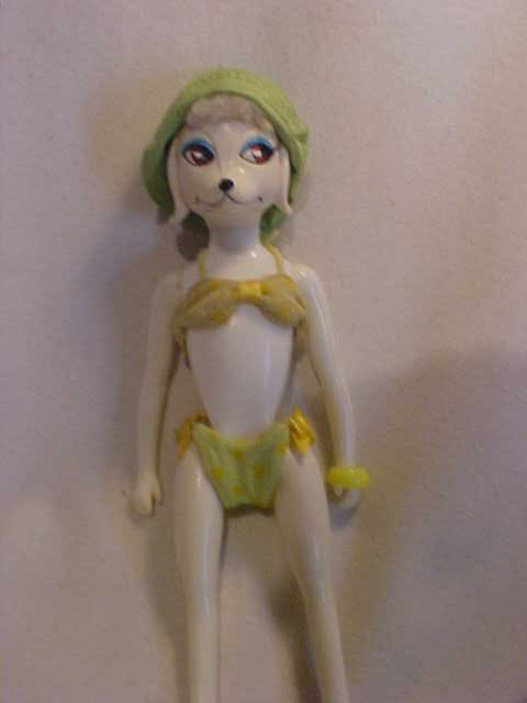 Early dog in bathing suit: Early dog in bathing suit. Measures 10" x 3"