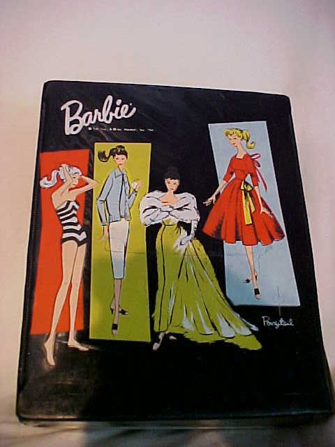 Barbie case with 3 dolls: Barbie case with 3 dolls. Measures 13" x 6" x 11".