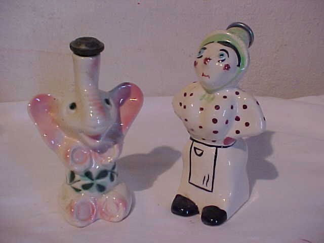 Lot of 2 water shakers: Lot of 2 water shakers for ironing. One signed Myrtle by Pealtzgrass Pottery co. "Mugsy". Measures range from 4" to 7" tall