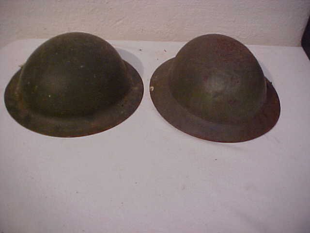 Lot of 2 Child's military helmets: Lot of 2 Child's military helmets. Measures 4" tall x 9 3/4" x 9 1/4"