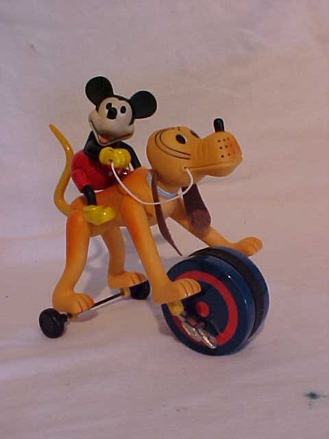 Disney "Mickey Riding Pluto" Wind Up Toy: Disney "Mickey Riding Pluto" Wind Up Toy Plastic Made by Schylling w/ Original Box Excellent Condition Measures 7" x 4 1/4" x 7"