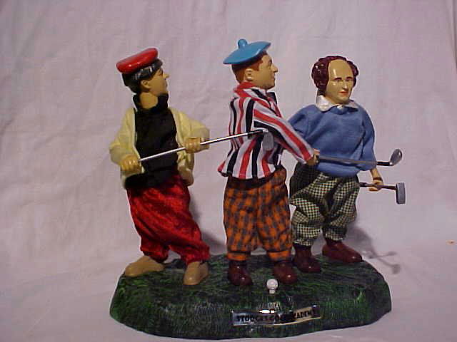 "The Three Stooges" animated golf scene toy: "The Three Stooges" animated golf scene toy with original box. Has power supply. Measures 11 1/2"H x 12"W x 7"D