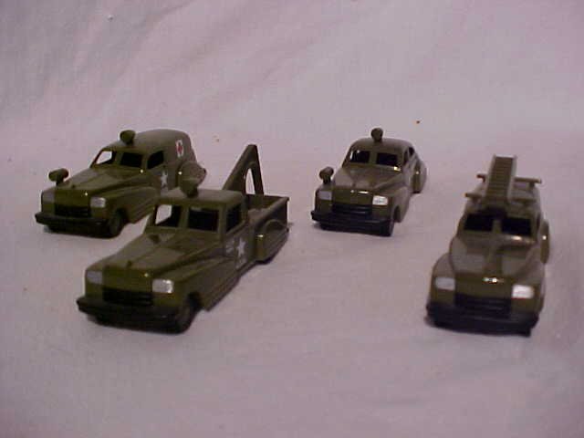 Lot of 4 Plastic cars with original boxes: Lot of 4 Plastic cars with original boxes. U. S. Army signal corps., military police, ambulance, and wrecker. Made by Binary Arts Corp. Measurements range from 1 1/2" - 2" tall x 4 3/4" - 5 3/4"L x 1 