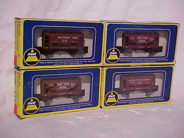 Lot of 4 AHM model train cars: Lot of 4 AHM (Associated Hobby Manufacturers) model train cars. Still in original boxes. HO scale. Consists of: (2) SOO Line 81714, Great Northern 88003, and Chicago & North Western 121361. Measures 1