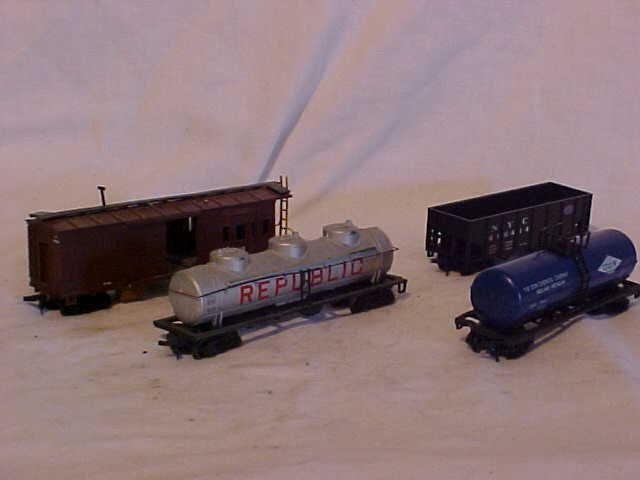 Lot of 4 Model Train Cars: Lot of 4 Model Train Cars HO Scale Very Good Condition Including CP 402258,Republic Tanker, NYC 416414 and Dow Tanker Minor Paint Damage Measures 1 1/2" - 2 1/4"h x 1 1/2"w x 4 1/2"-6 1/4"l