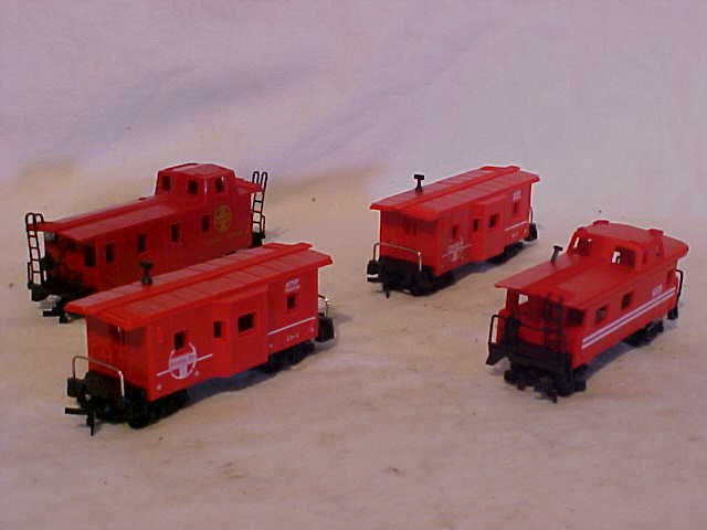 Lot of 4 Model Train Cabooses: Lot of 4 Model Train Cabooses HO Scale Very Good Condition Including (2) ATSF 999056,689, and Sante Fe 999628 Measures 2"-2 1/4"h x 1 1/2" x 1 1/2"w x 5"-5 1/2"L