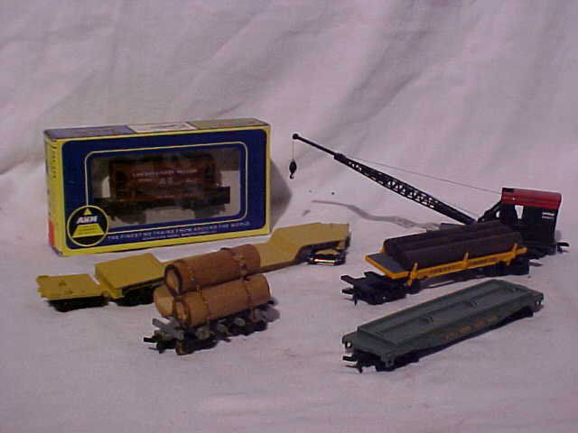 Lot of 6 Model Train Cars: Lot of 6 Model Train Cars HO Scale Fair-Excellent Condition Including AHM Chicago & North Western (still in box), Crane Car and (4) Flat Bed Cars Measures 5/16"-3 1/2"h x 1 1/2"w x 3"-8 1/2"L