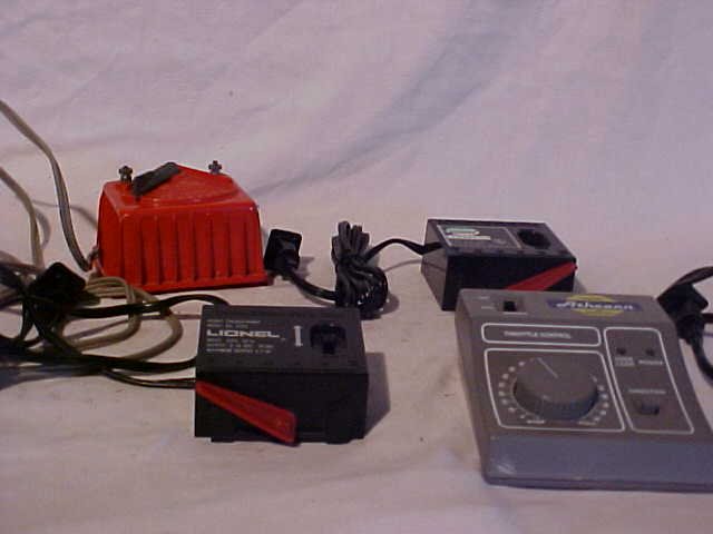 Lot of 4 Model Train Transformers: Lot of 4 Model Train Transformers (2) Lionel, Model Power and Athearn Still Works Good Condition Measures 2 1/4"-3"h x 3 1/2"-4 1/2"w x 3"-5 1/2"L