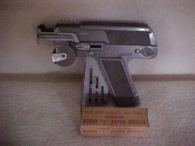 JMCO super-numatic cap gun w/Buddy L paper refills: JMCO super-numatic cap gun w/4 genuine Buddy L paper refills. Measures 5 3/4" x 4 1/4"