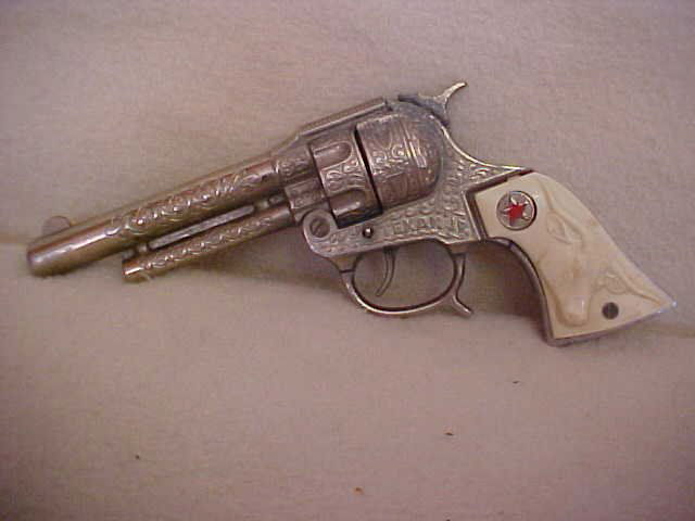 Texan JR cap gun: Texan JR cap gun. Measures 8 3/4"L x 4"
