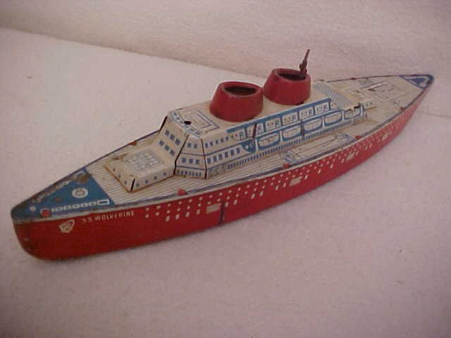Wolverine tin litho wind up ship: Wolverine tin litho wind up ship. Measures 14"L x 2 3/4"W