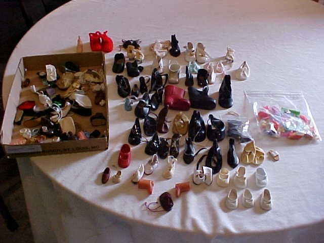 Box lot of doll shoes: Box lot of doll shoes. Misc. sizes
