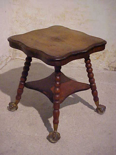 Victorian era parlor table w/glass ball feet.: Victorian era parlor table w/glass ball feet. Mahogany paror table w/turned legs metal & glass ball feet. Top veneer need repair. Measures 29"tall x 26-1/2" wide & deep.