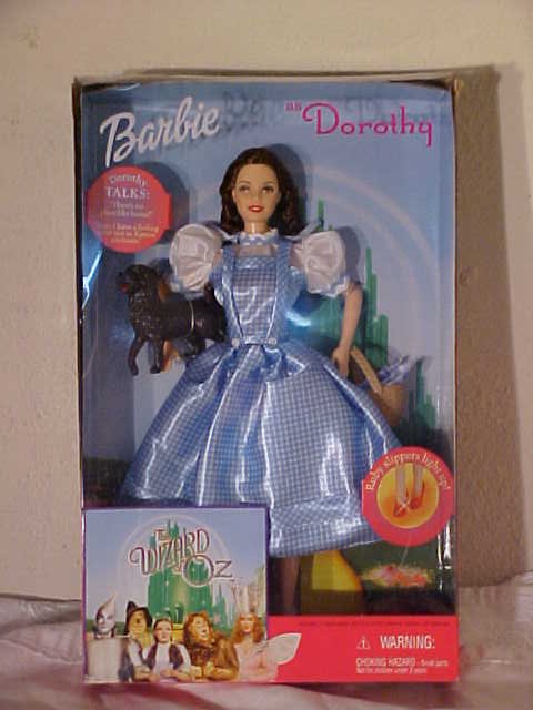 Lot of 4 The wizard of Oz Barbie dolls.: Lot of 4 The wizard of Oz Barbie dolls. Dorothy, The Cowrdly Lion. Scarecrow, & The Tin Man. In box. Box 12 3/4 tall x 8 wide x 2 1/2 deep.