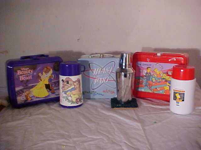 Lot of 3 lunch boxes: Lot of 3 lunch boxes. 1 Metal & 2 Pastic. (1) Metal "Blast from the Past" lunch box w/ Alcia Silverstone and Brendan Fraser Contains Astro turf drink coaster, Tumbler for mixing drinks, cassett tap, v