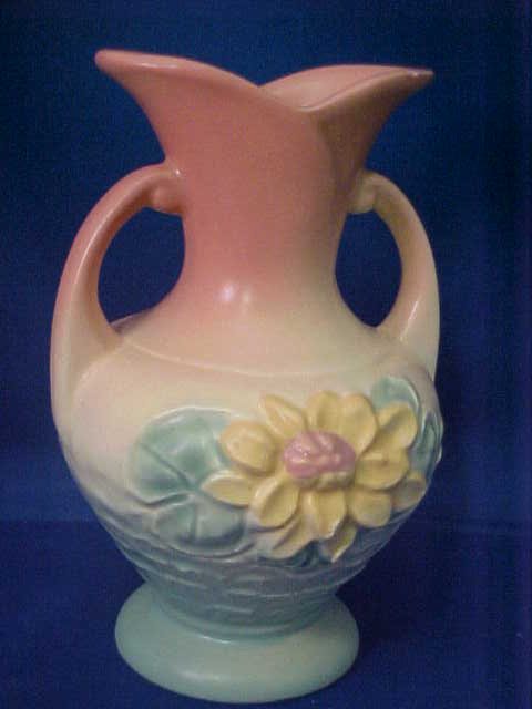 Signed Hull pottery vase.: Signed Hull pottery vase. 2 minor chips. Measures 6"tall x 4"deep x 4"wide.