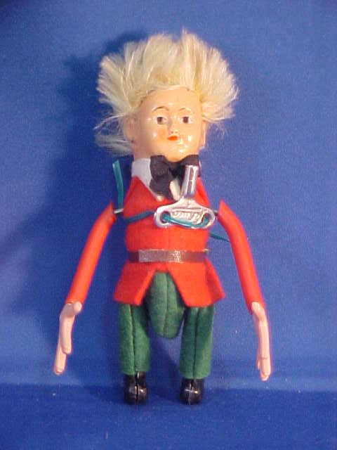 Schuco wind up tin doll: Schuco wind up tin doll. Measures 3"H x 2-1/2"W x 1/2"D