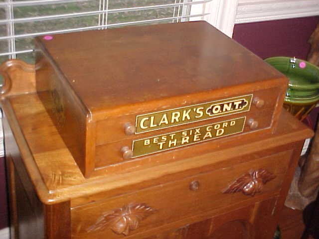 Clark's O.N.T. Cherry spool cabinet: Clark's O.N.T. Cherry spool cabinet. Measures 6-1/2" tall x 20" wide x 15" deep