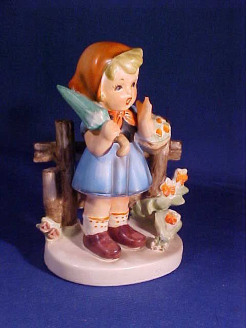 Hummel style figurine: Hummel style figurine. Designed by Erich Stauffer. Measures 5-1/2" tall
