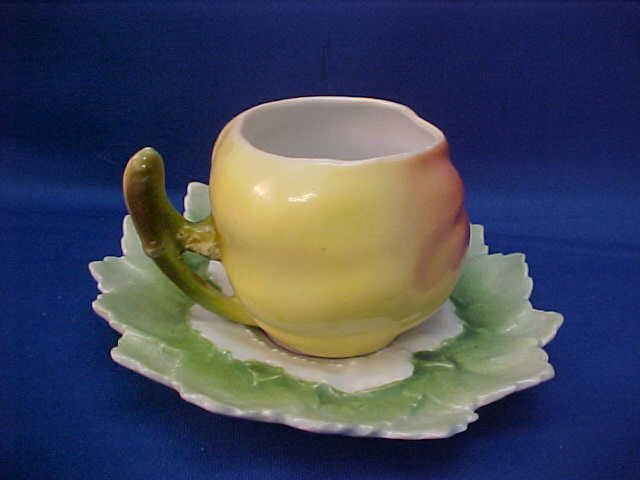 Royal Bayreuth Yellow/Red Apple cup and saucer: Royal Bayreuth Yellow/Red Apple cup and saucer. Measures 4-1/4" wide. No markings