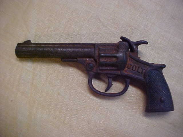 Early cast iron Colt cap gun pistol.: Early cast iron Colt cap gun pistol.