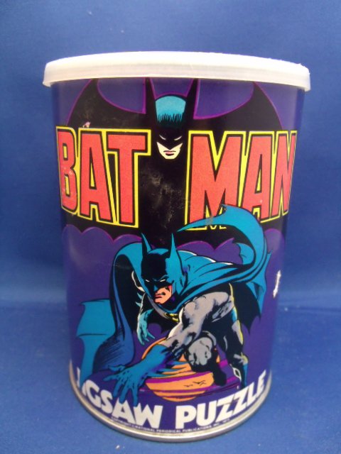 Batman 81 Big Piece Jigsaw Puzzle: Batman 81 Big Piece Jigsaw Puzzle. In original container. Made by American Publishing Corp. Measures 5-1/2" tall x 4" round.