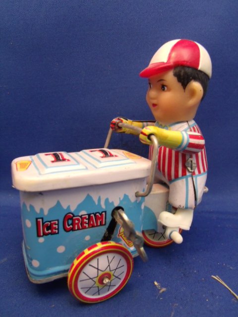 Tin litho wind up toy: Tin litho wind up toy. Does work. Measures 4-1/2" tall x 2" wide x 4" long