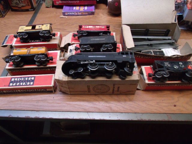 6 pc. 'O' Guage Lionel Train Set w/Tracks: 6 pc. 'O' Guage Lionel Train Set w/Tracks. With original boxes. Consists of: 238 Pennsylvania engine, 2225W car, 2653 Coal car, 2655 Shell fuel car, 2657 Caboose, and tracks.