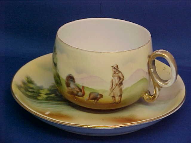 Royal Bayreuth hunter & turkey scene cup & saucer: Royal Bayreuth hunter & turkey scene cup & saucer