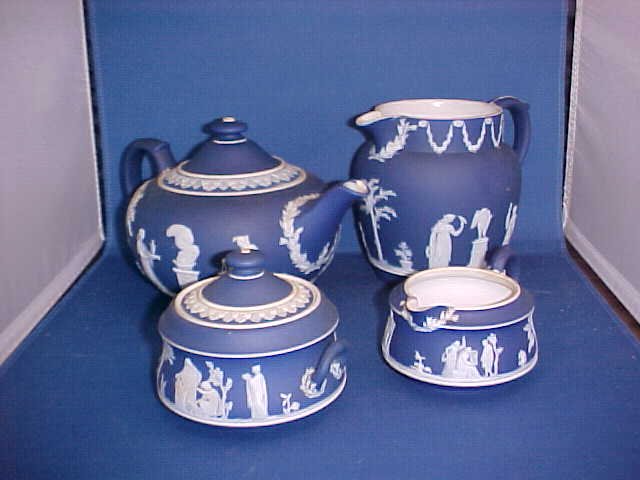4 pc. Wedgewood Jasperware set: 4 pc. Wedgewood Jasperware set. Measurements range up to 5-1/4" tall x 7" wide.
