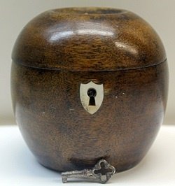 Hand Carved Antique Wood Apple LockBox w/ Key: Hand Carved, Antique Wood, Apple Shaped, Lockbox with Skeleton Key, Gilded metalwork hinges, and mechanically working Lock, (Missing (1) one small nail & apple stem,) Size Approx. 5 1/2" x 3 1/2" x 3 