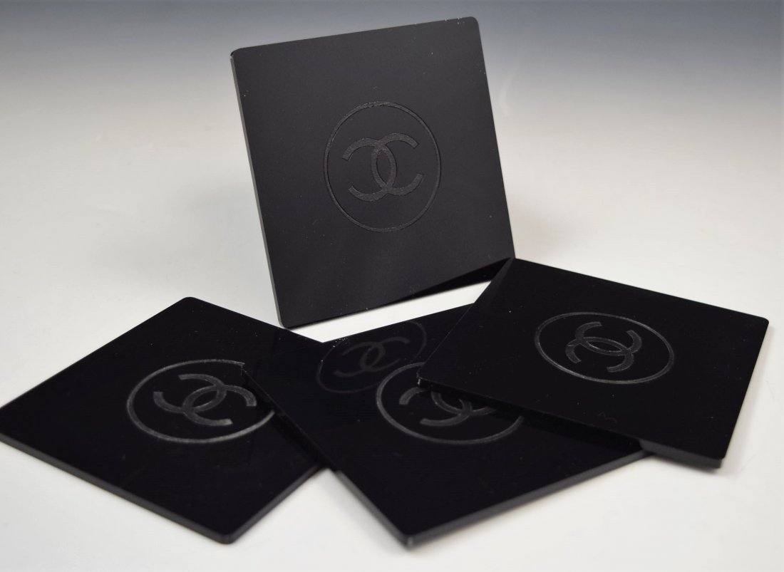 Chanel Coasters: Chanel issued black acrylic coasters set of 4