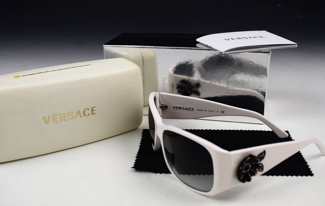 Versace Sunglasses: Versace womans sunglasses with white frame and black lens Versace box and case included