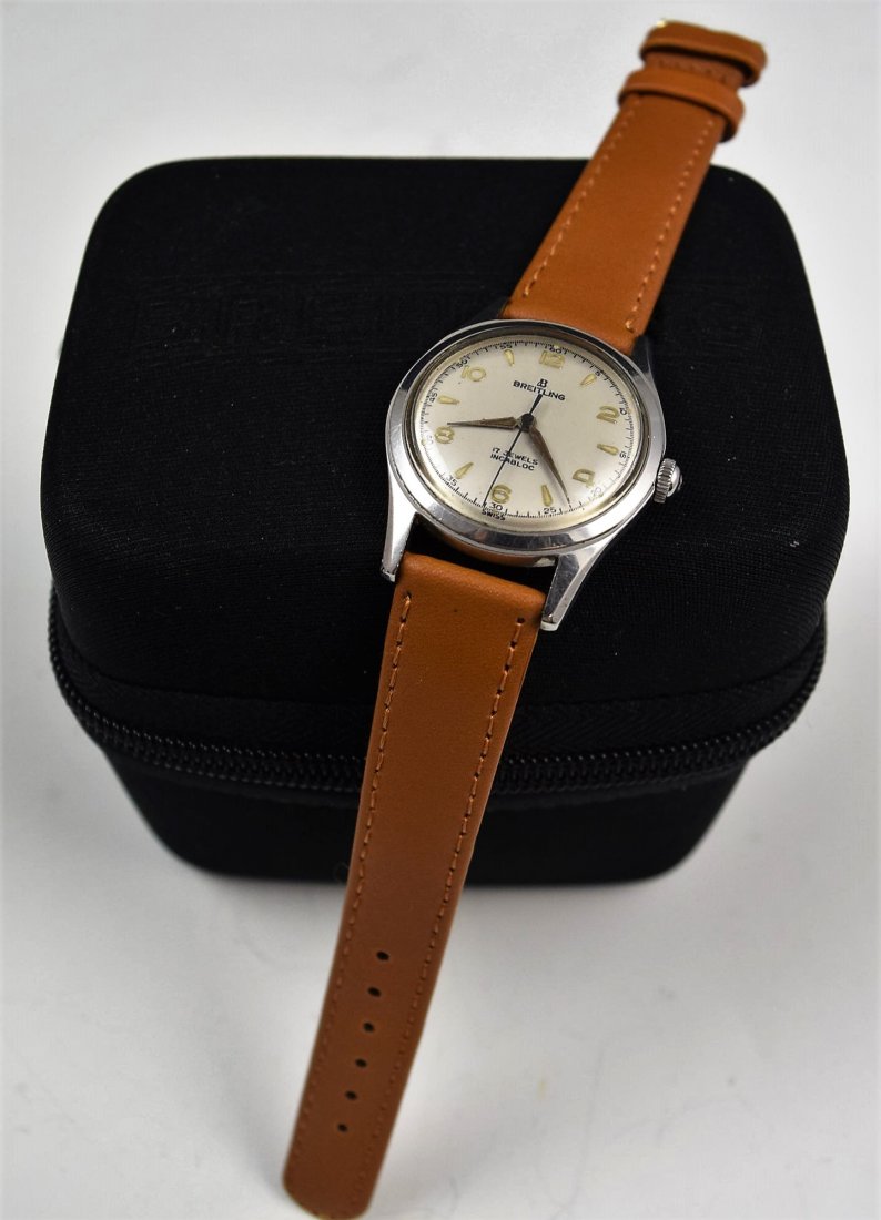 Vintage Breitling Watch: A vintage Breitling watch with service case