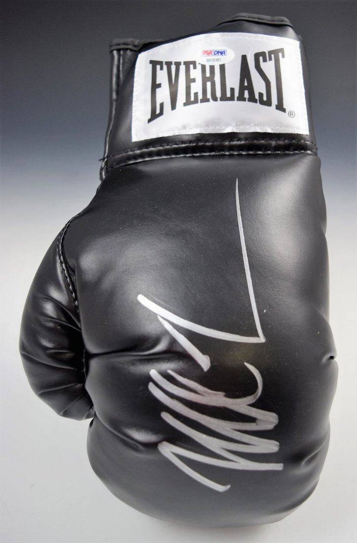 Mike Tyson Glove Autograph: An Everlast boxing glove signed by Mike Tyson, COA included