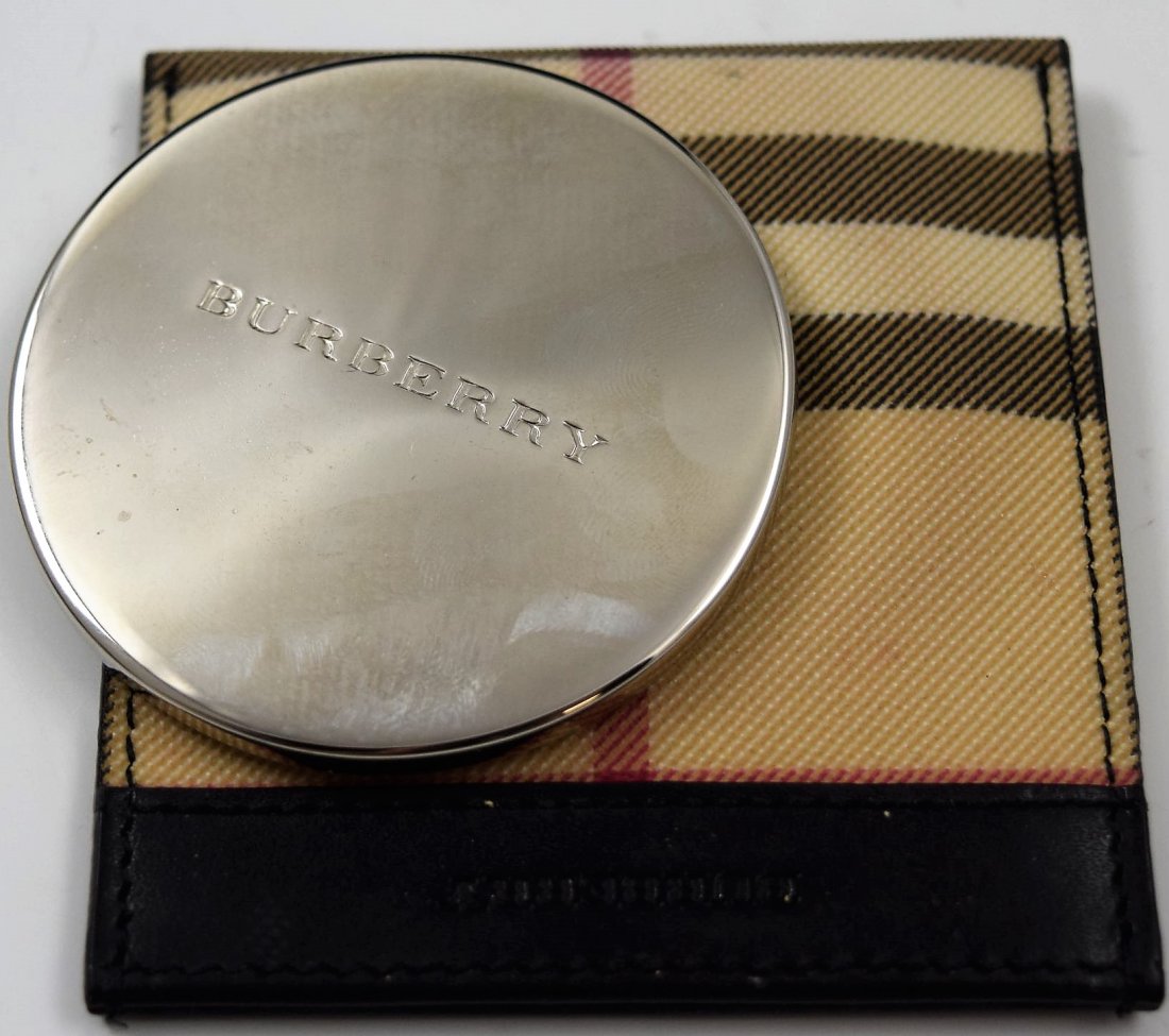 Burberry Mirror: Burberry issued pocket mirror with original pouch Measures: 3 x 3 inches