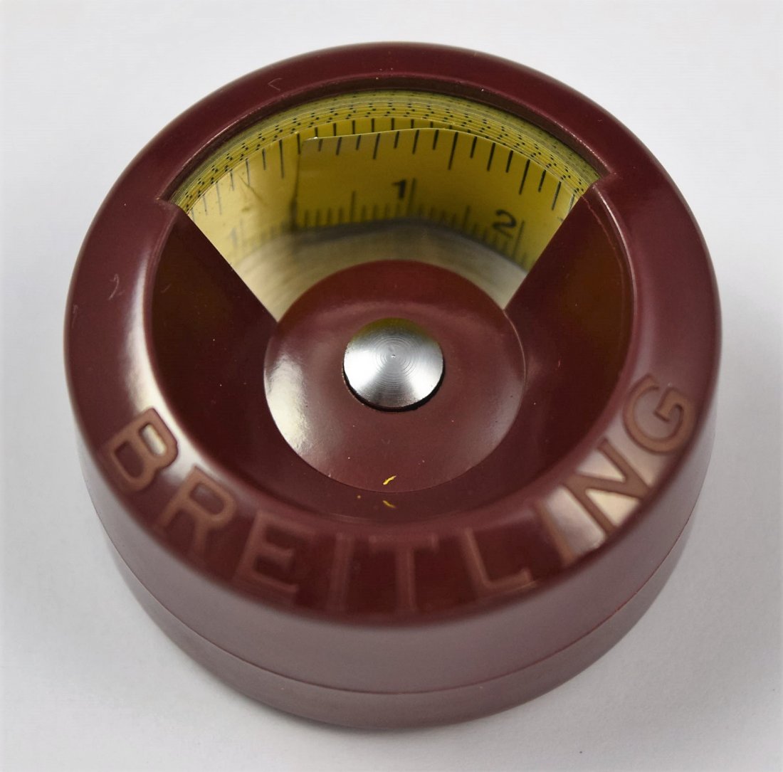 Breitling Tape Measure: Breitling tape measure Burgundy color hard plastic case with yellow metal tape