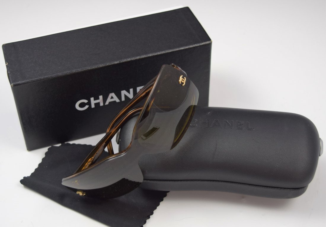 Chanel Sunglasses: Chanel issued brown sunglasses with original case and card