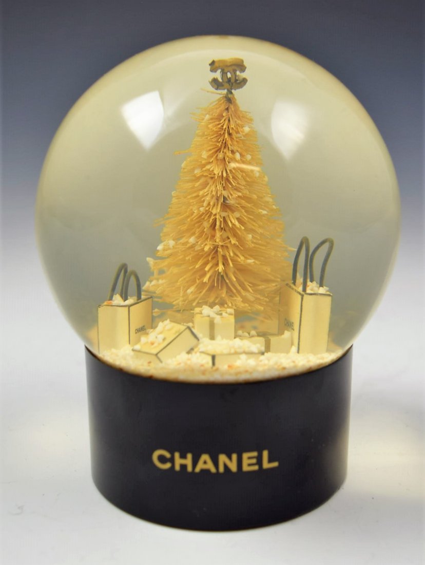 Chanel Snow globe: Chanel issued Christmas snow globe Measures: 4 1/2 inches