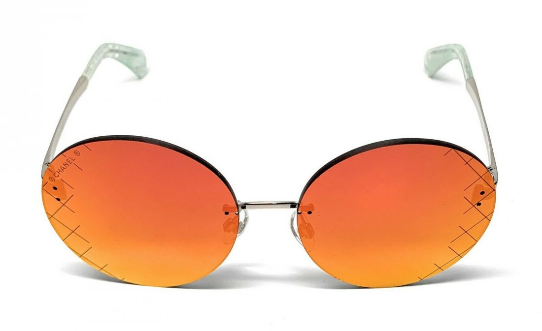 Chanel Sunglasses: Chanel issued silver and red mirrored woman's sunglasses