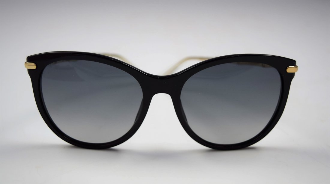 Gucci Sunglasses: Gucci issued woman's black sunglasses with bamboo accents