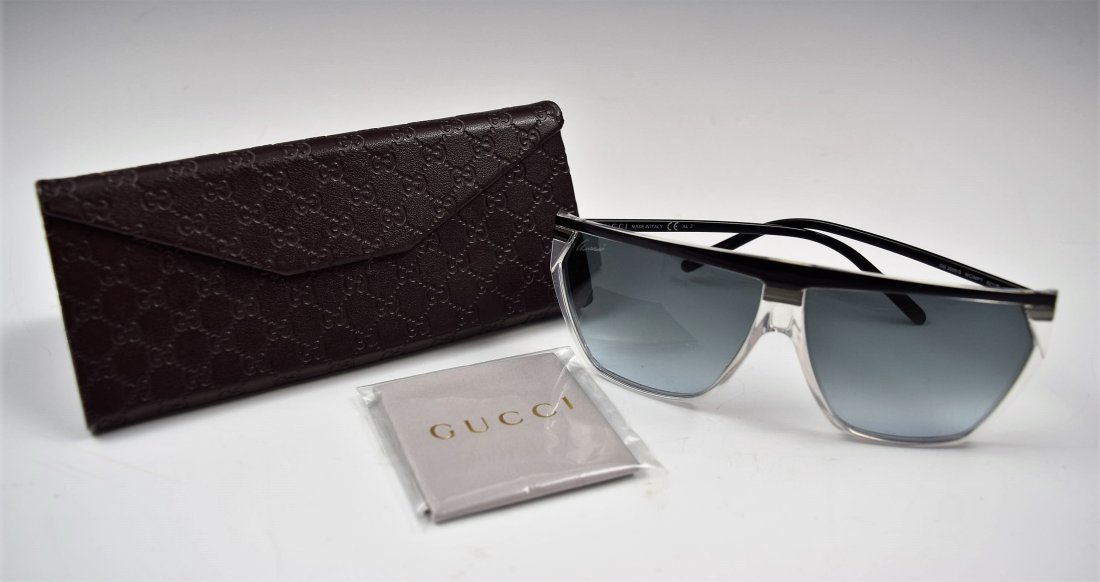 Gucci Sunglasses: Gucci issued black granite sunglasses Original case included